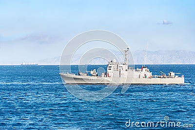 RHODES, GREECE â€“ SEPTEMBER 21 2017: HS Ormi â€“ Greek gunboat P230 leaves port in city of Rhodes. Coast of Turkey in background Editorial Stock Photo